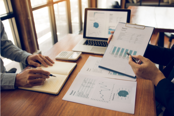 Close up of two businesspeople reviewing a Managed Print Services Assessment