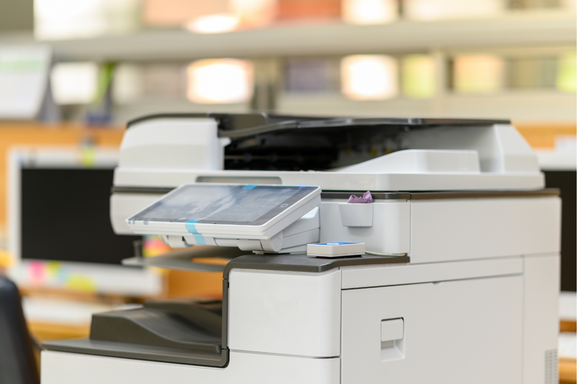 A close up of an office multifunction printer signifying office equipment.
