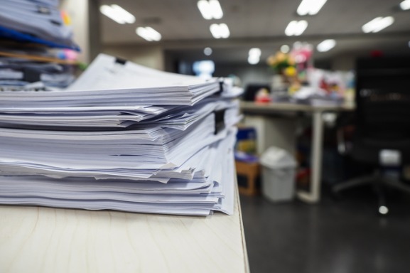 Stacks of collated paper representing the importance of a production printer